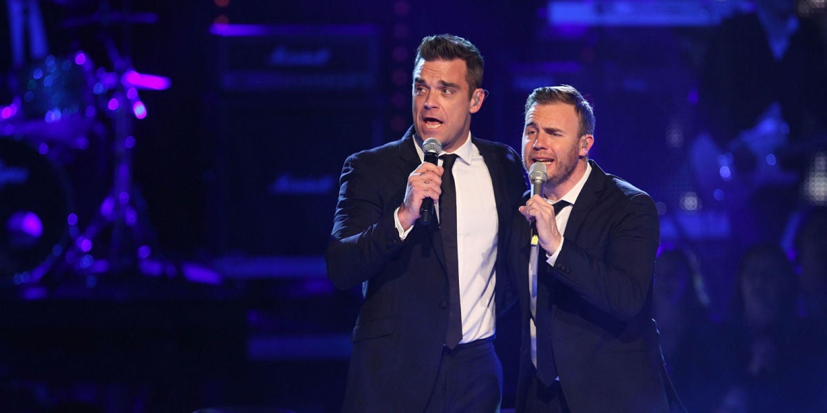 Robbie Williams cantando con su ex banda, Take That