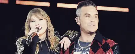 Taylor Swift y Robbie Williams cantan juntos 'Angels' Taylor Swift y Robbie Williams cantan juntos 'Angels'
