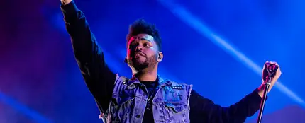 The Weeknd durante un concierto The Weeknd durante un concierto
