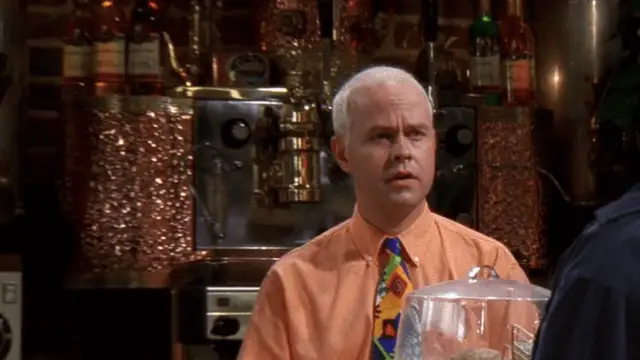 James Michael Tyler , interpretando a Gunther en un capítulo de 'Friends'