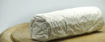 Imagen de un queso rulo de cabra Imagen de un queso rulo de cabra
