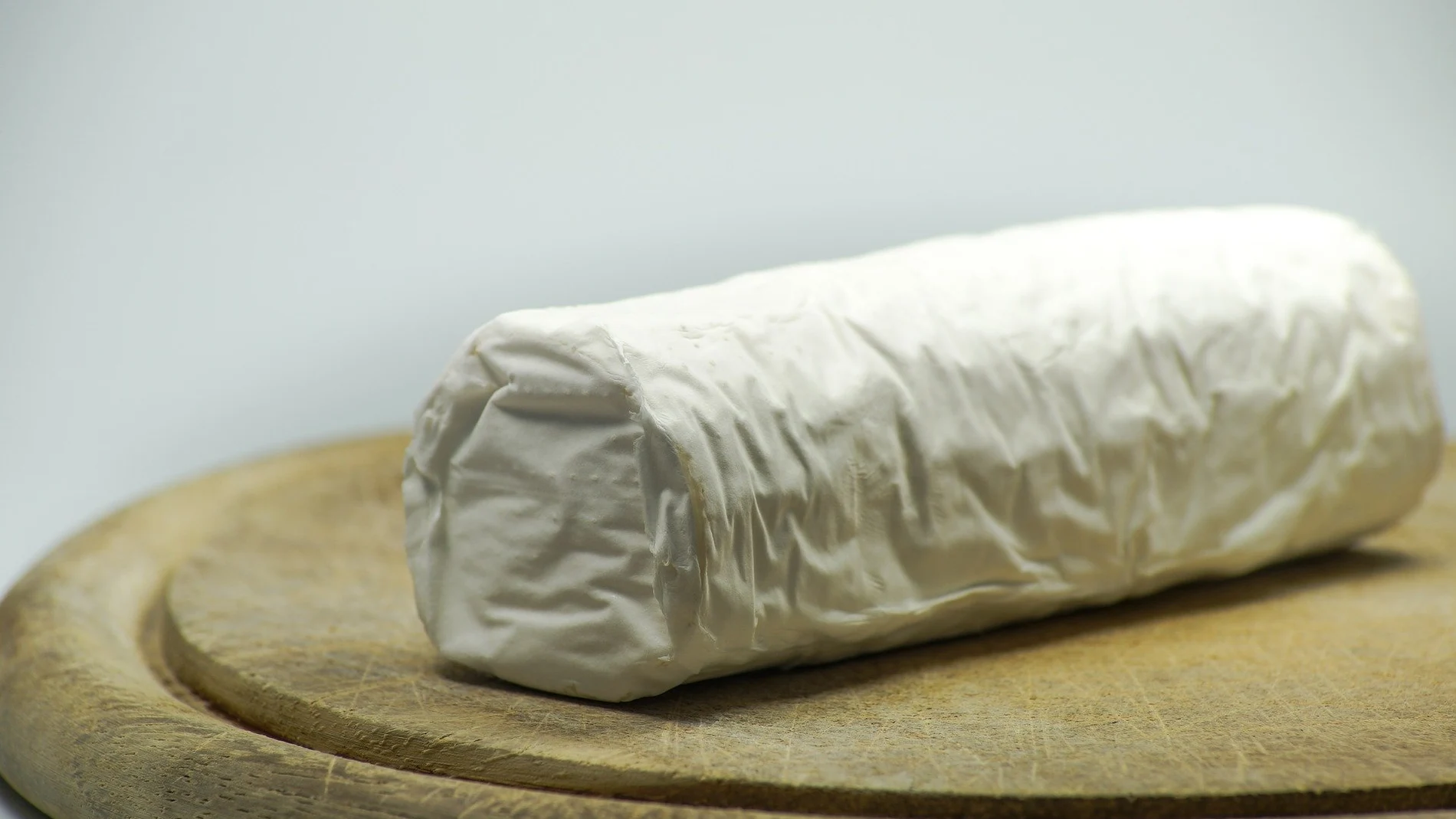 Imagen de un queso rulo de cabra Imagen de un queso rulo de cabra