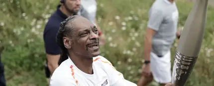 Snoop Dogg llevando la antorcha olímpica Snoop Dogg llevando la antorcha olímpica